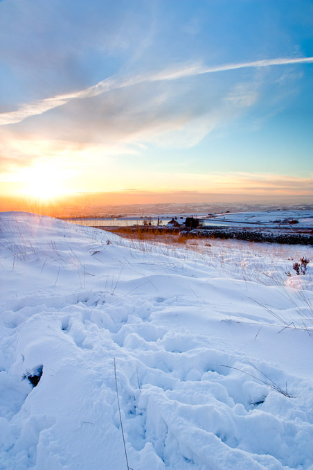 Sunset over a snow-covered Scout Moor, near Ramsbottom.